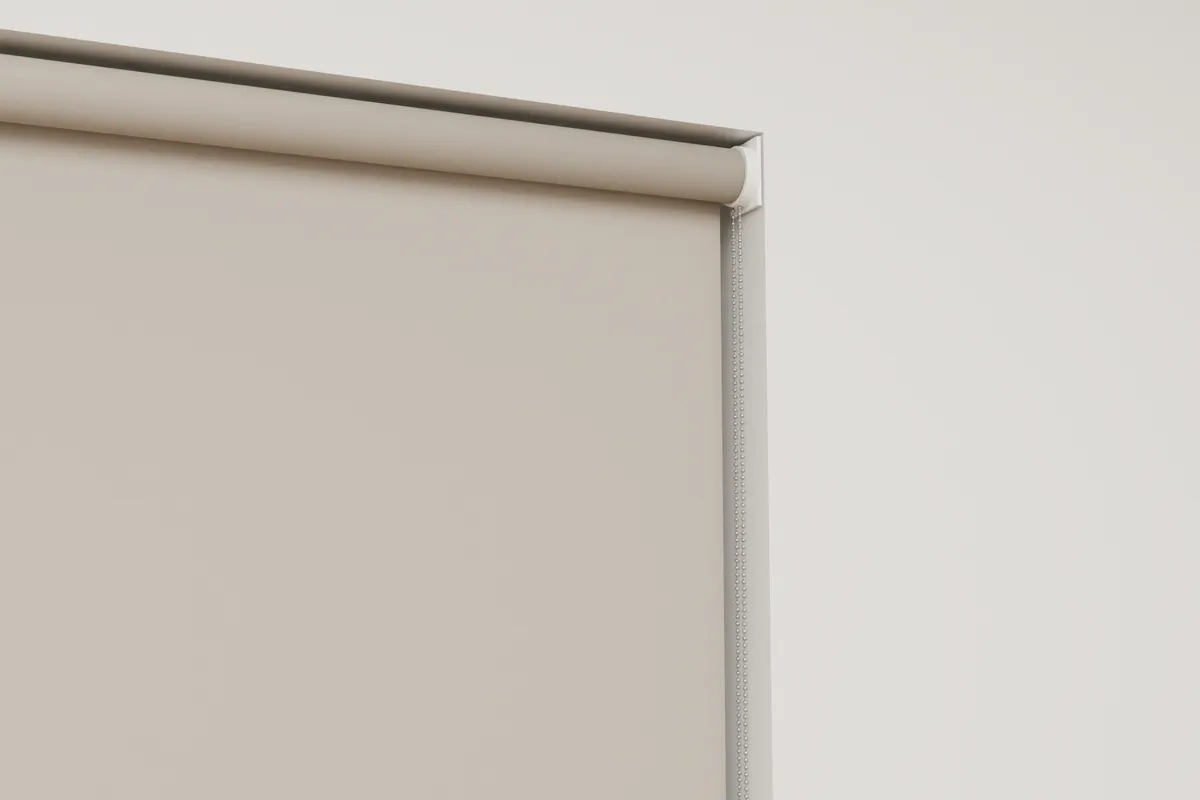 The top corner of a roller blind close up, with the length of the chain at its side marked